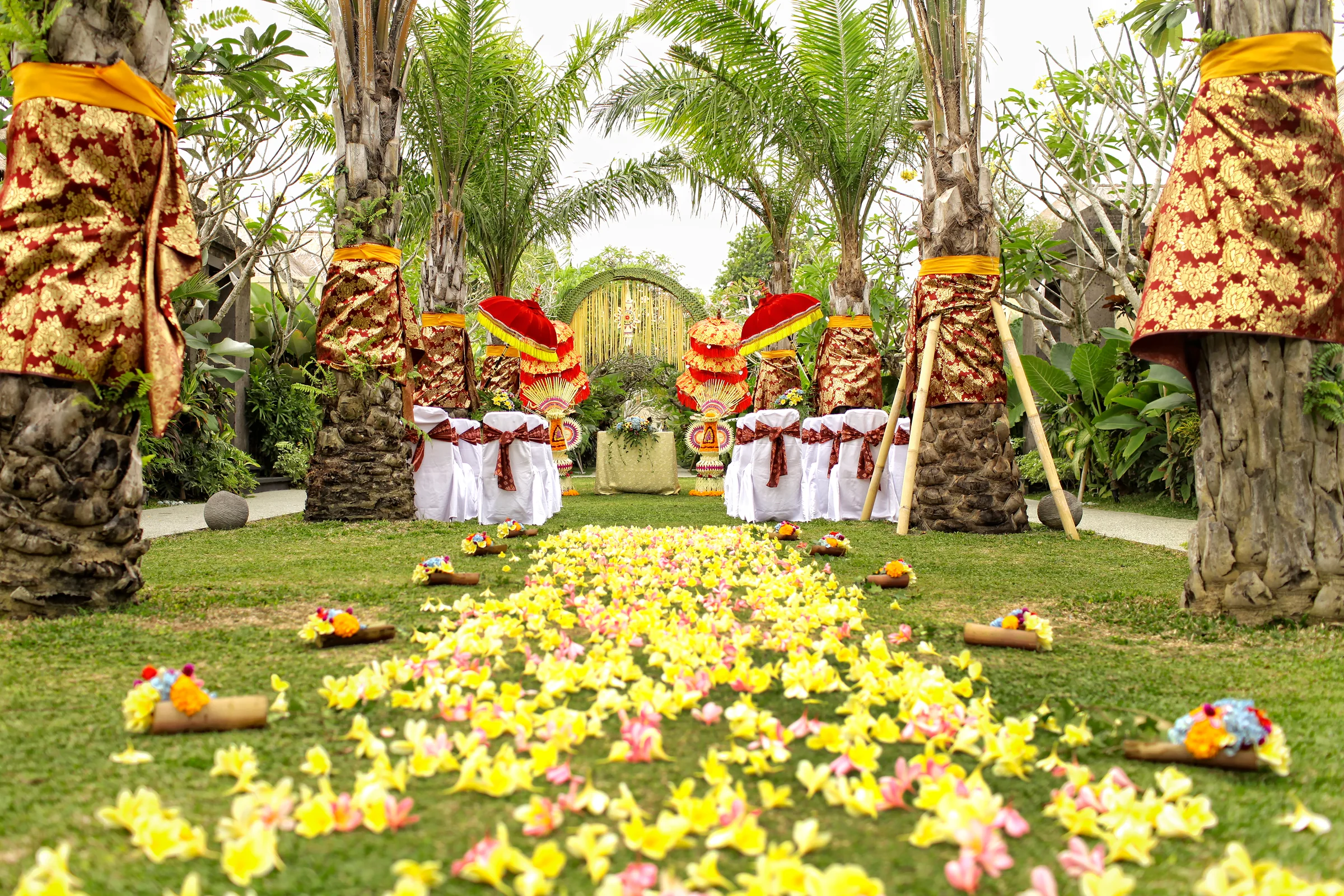 A traditional Balinese wedding aisle surrounded by the Mahagiri garden